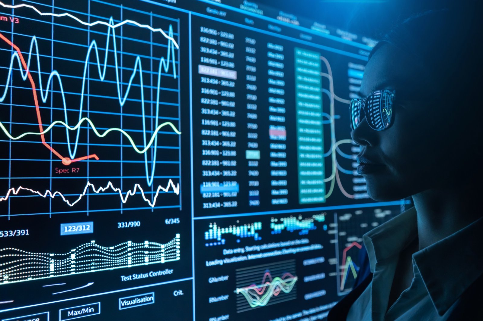 The businesswoman works with infographic on a black monitor.