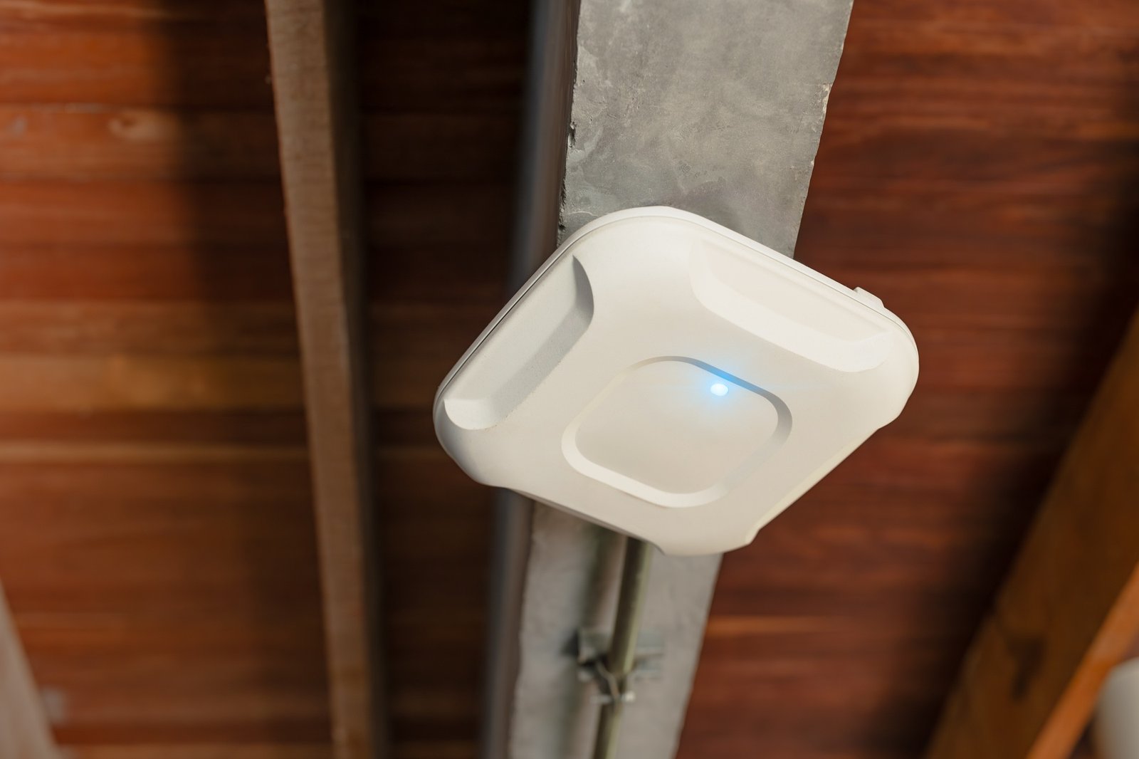 Wireless router for internet local network at ceiling. Indoor networking technology. WIFI router