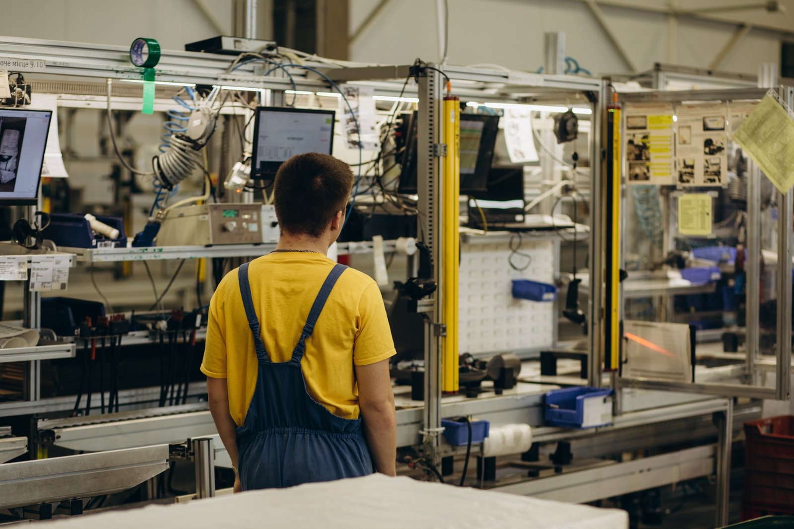 Young factory job worker or engineer close up portrait in manufacturing factory .